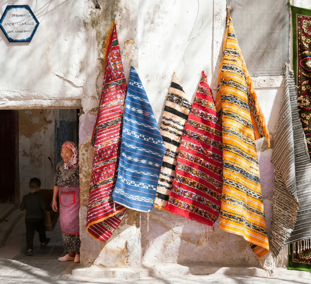 Iwziwn berber woman and carpets